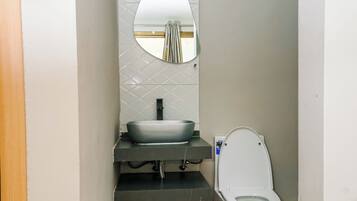 Shower, towels, soap, toilet paper