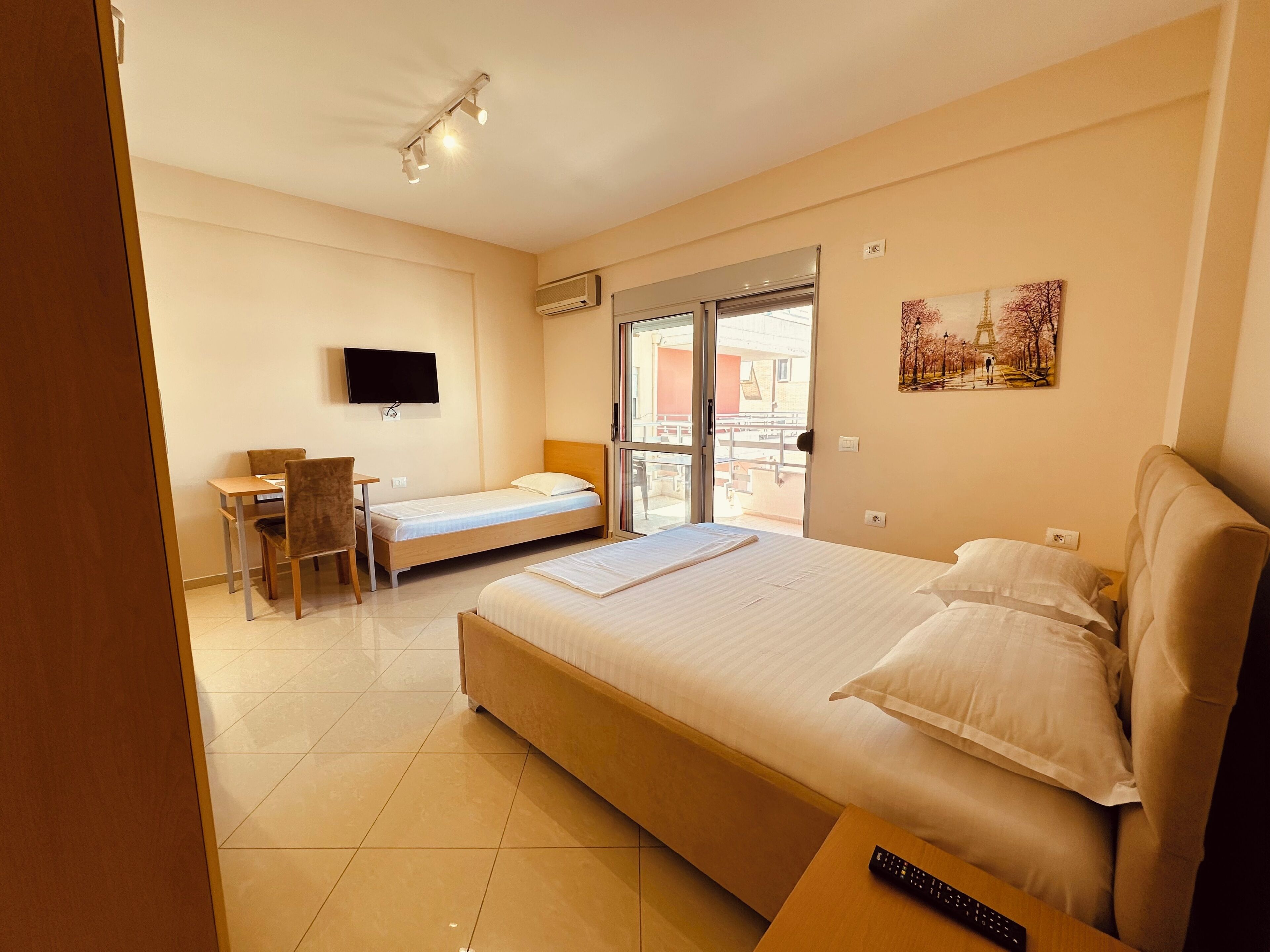 Economy Studio, Balcony, City View | Desk, WiFi (free), bed sheets