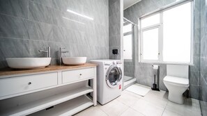 Shower, towels, soap, toilet paper
