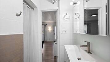 Studio Suite, 1 Queen Bed, Garden View (Chic City Retreat 97) | Bathroom | Shower, hair dryer, towels