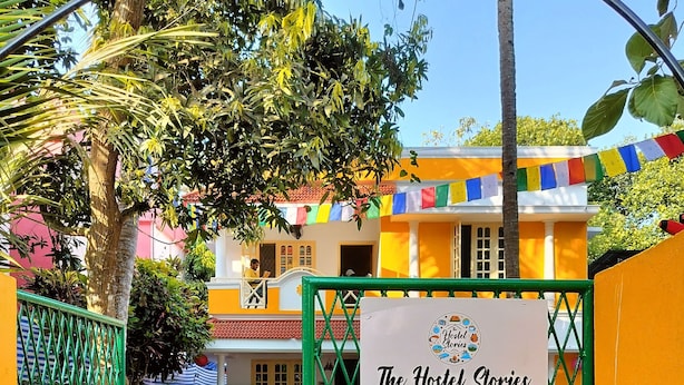 A gated entrance to a hostel with a sign reading "The Hostel Stories Stay Adventurous, Stay Social". - The Hostel Stories Varkala (Varkala)