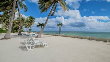 On the beach, sun loungers, beach towels