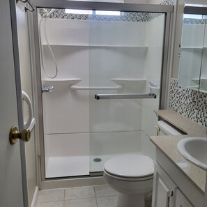 Shower, hair dryer, towels, soap