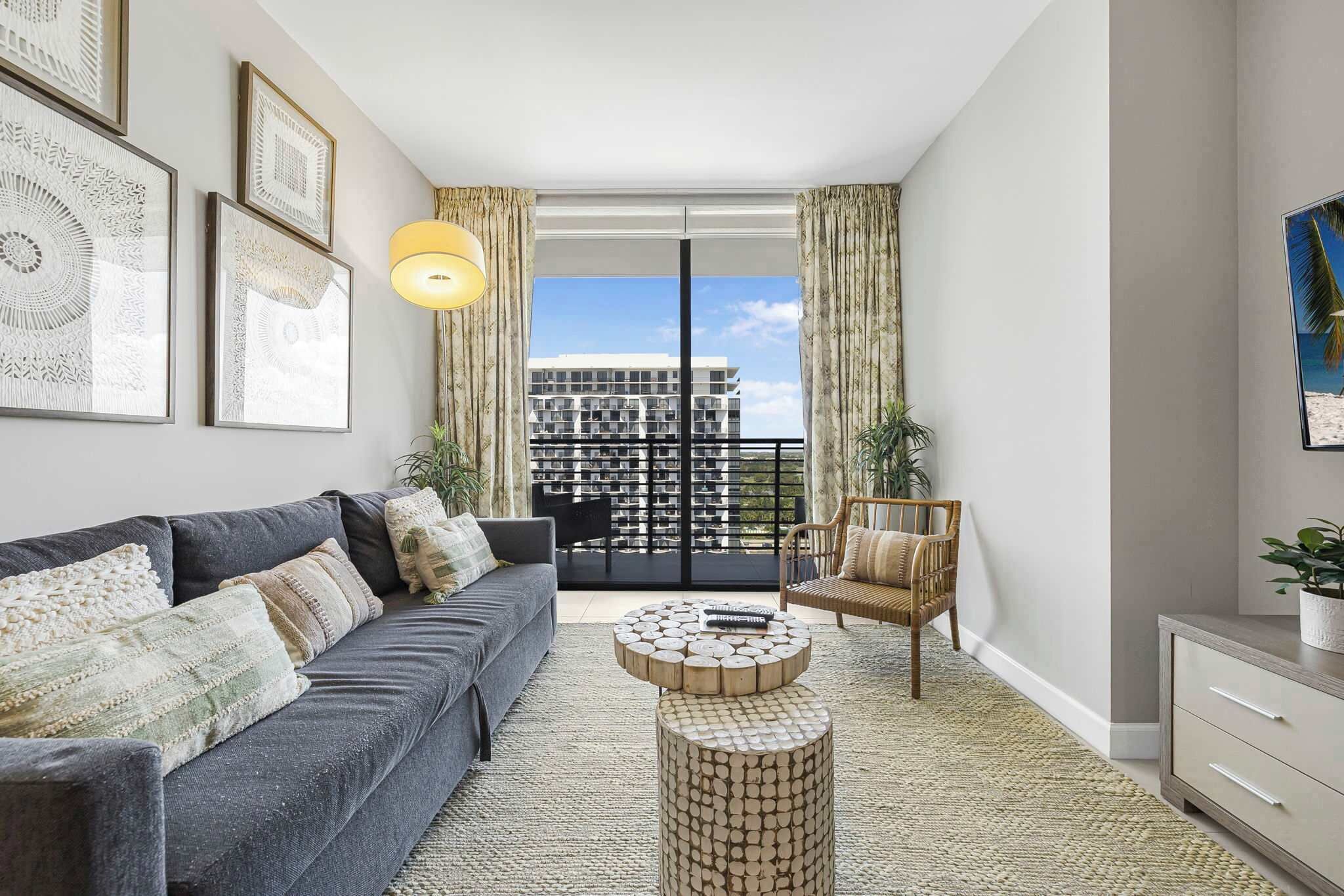 Comfort Condo, 1 Bedroom, Balcony, City View | Living area | 50-inch plasma TV with cable channels