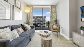 Comfort Condo, 1 Bedroom, Balcony, City View | Living area | 50-inch plasma TV with cable channels