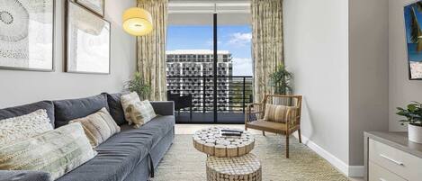 Comfort Condo, 1 Bedroom, Balcony, City View | Living area | 50-inch plasma TV with cable channels