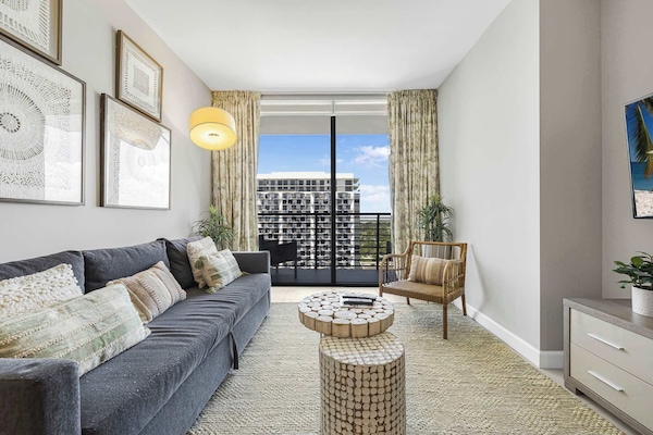 Comfort Condo, 1 Bedroom, Balcony, City View | Living area | 50-inch plasma TV with cable channels