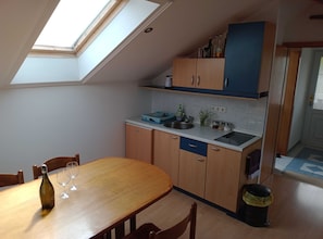 Coffee/tea maker, fridge, stovetop, toaster