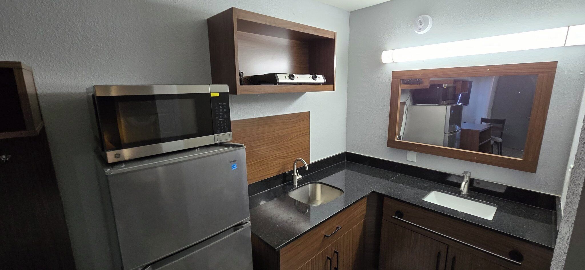 Full-size fridge, microwave, cookware/dishes/utensils, dining table