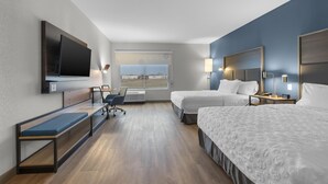 A hotel room with two beds, a desk, a chair, a TV, and a window with a view. - Tru By Hilton Cape Girardeau (Cape Girardeau)