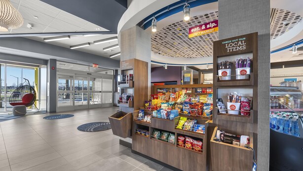 A modern retail area with a display of local items and snacks. - Tru By Hilton Cape Girardeau (Cape Girardeau)