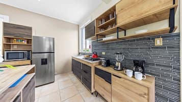 Fridge, microwave, stovetop, coffee/tea maker
