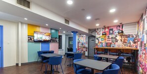 Relax and work in style with comfortable seating and vibrant artwork.
