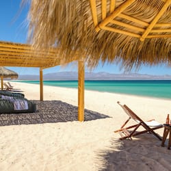 On the beach, white sand, windsurfing