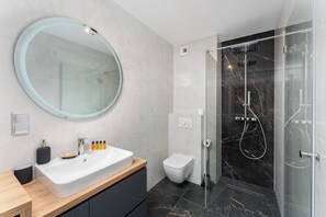 Shower, hair dryer, towels, soap