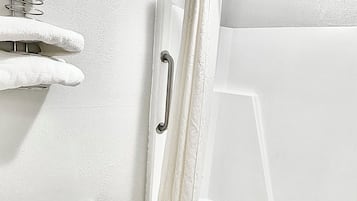 Combined shower/tub, hair dryer, towels, soap