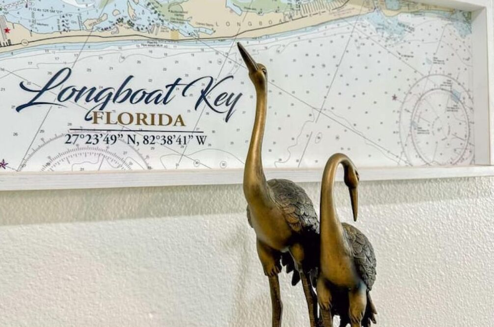 A Longboat Key, Florida map with a compass rose and coordinates.