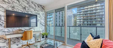 Business Suite, City View | Living area | 65-inch Smart TV with digital channels