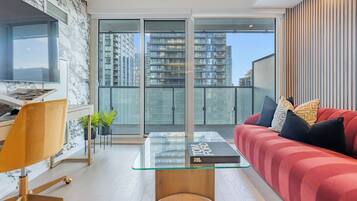 Business Suite, City View | Living area | 65-inch Smart TV with digital channels