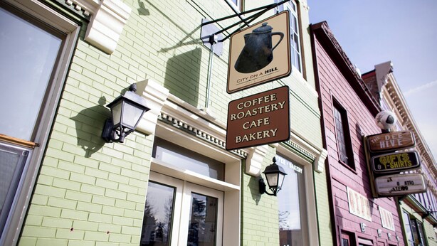 A coffee roastery and bakery with a vintage sign, located on a street corner. - The Leadville Bunkhouse (Leadville)