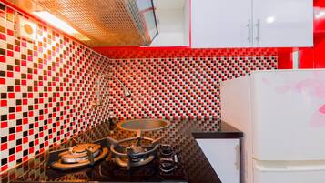 Apartment | Private kitchen | Full-size fridge, stovetop, rice cooker, dining tables