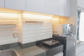 Private kitchen - Good And Comfy Studio At Transpark Cibubur Apartment (Depok)