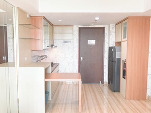 Apartament | Cuina privada | Frigorífic gran, placa de cuina i arrossera