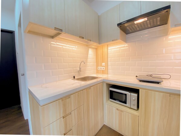 Apartment | Private kitchen - Urban Designed 3Br At Grand Asia Afrika Apartment (Bandung)