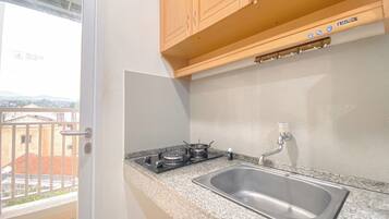 Apartment | Private kitchen | Full-size fridge, stovetop, rice cooker, dining tables