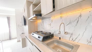 Apartment | Private kitchen | Full-sized fridge, stovetop, rice cooker