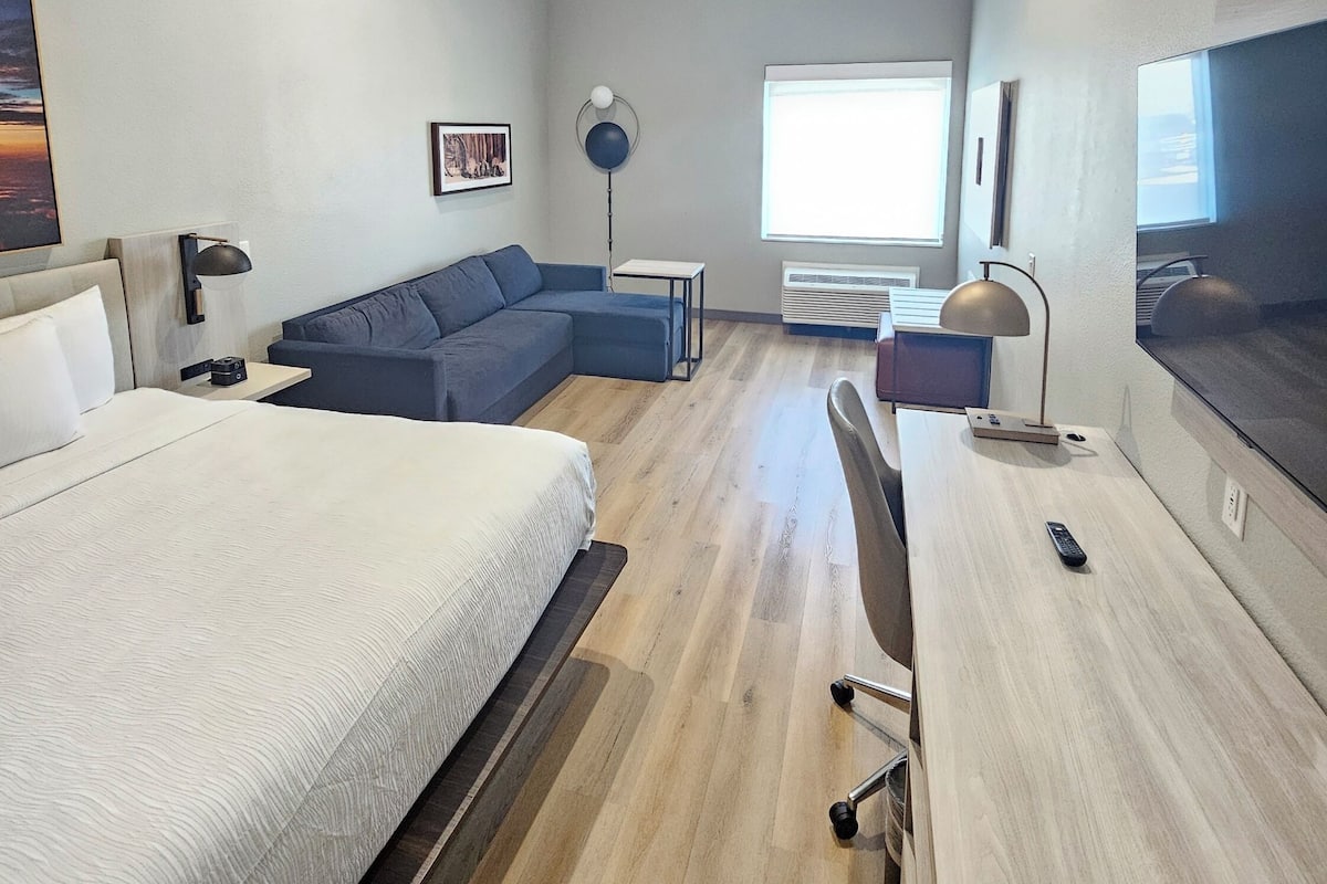 Desk, laptop workspace, blackout curtains, iron/ironing board