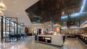 A modern hotel lobby with a central island, seating area, and large windows. - MEHOOD LESTIE Hotel (Shanghai Xujiahui Wukang Road) (Shanghai)