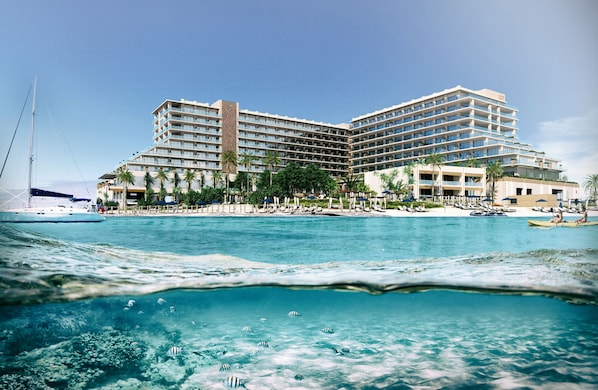 On the beach, white sand, beach cabanas, sun loungers