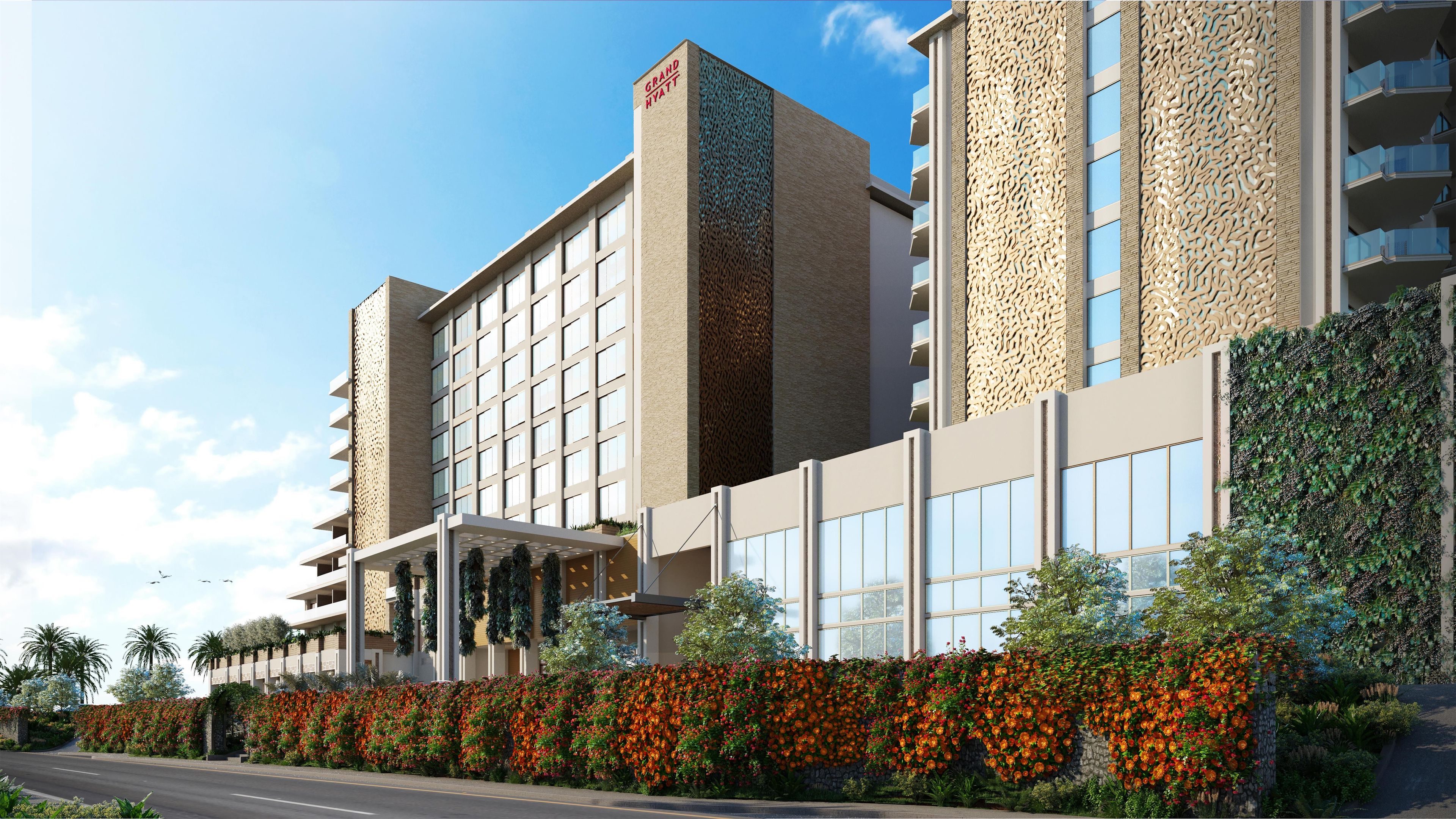 Un hôtel doté d’une façade moderne, de plusieurs étages et d’une entrée imposante.
