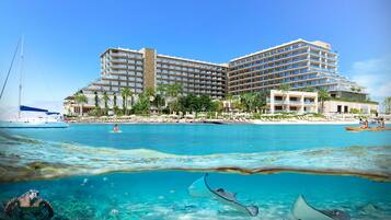 On the beach, white sand, beach cabanas, sun loungers