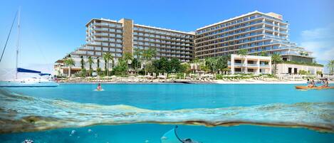 On the beach, white sand, beach cabanas, sun-loungers