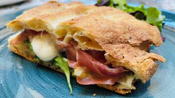 A sandwich on a blue plate.