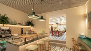 A modern cafe with a bar area, seating, and a patterned floor. - Cloud 7 Roma Hotel (Rome)