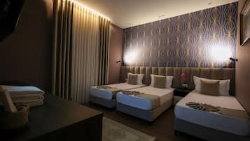 Deluxe Triple Room, Garden View | 1 bedroom, minibar, in-room safe, desk