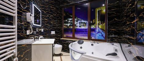 Junior Suite, Garden View | Bathroom | Free toiletries, hair dryer, slippers, bidet