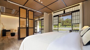 A modern hotel room with a large bed, sliding shoji screens, and large windows offering a view of the outdoors. - Xiyang Yishan Quiet Private Onsen Country Style Vacation Courtyard (Qingyuan)