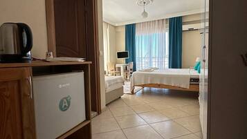 Standard Triple Room | Desk, laptop workspace, free WiFi, bed sheets