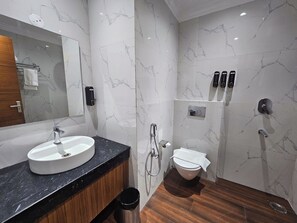 Shower, rainfall showerhead, slippers, towels