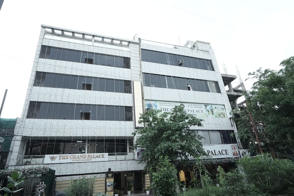 A multi-story building with a sign for "The Grand Palace" indicating it is a hotel. - The Grand Palace  (Ghaziabad)