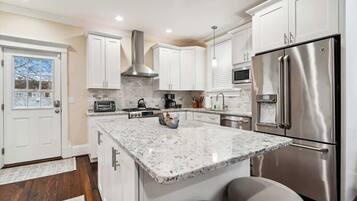 Dishwasher, coffee/tea maker, cookware/dishes/utensils