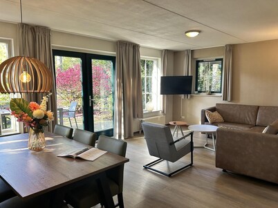 Comfortable bungalow with open kitchen, 3 bedrooms, 2 bathrooms, and optional sauna.