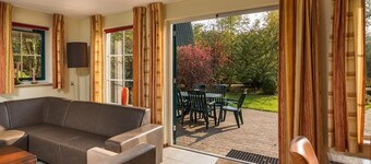 Luxury bungalow with open kitchen, spacious terrace, 3 bedrooms, 2 bathrooms, and optional sauna.