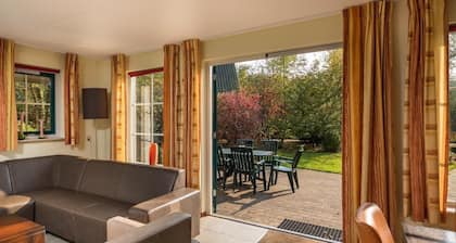 Luxury bungalow with open kitchen, spacious terrace, 3 bedrooms, 2 bathrooms, and optional sauna.