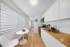 Fridge, microwave, stovetop, coffee/tea maker