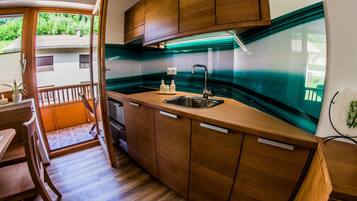 Apartment (One Bedroom Apartment with Balcony) | Private kitchen | Fridge